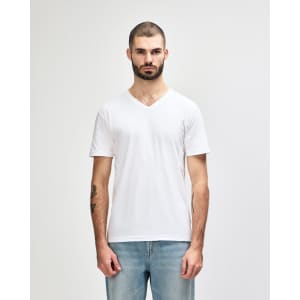 A white Gildan Softstyle adult V-neck T-shirt displayed on a male model, featuring a simple design and a branding logo.