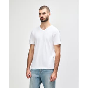 A man wearing a white Gildan Softstyle adult v-neck t-shirt, standing in profile against a plain background.