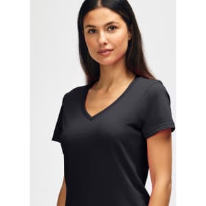 A black Gildan Softstyle ladies' V-neck T-shirt displayed on a model with straight hair. It features a logo.