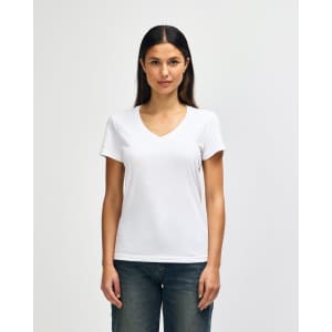 A white ladies' V-neck t-shirt displayed on a model, featuring a comfortable fit and short sleeves.