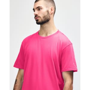 A midweight adult T-shirt in vibrant pink, featuring a round neck and short sleeves, with a logo visible.