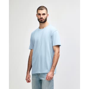 A midweight adult T-shirt in a light blue colour, featuring a round neck and short sleeves, with a logo.