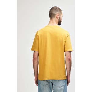 A midweight T-shirt in mustard yellow, featuring a plain back and a logo.