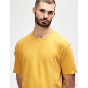 A midweight adult t-shirt in a mustard yellow colour, featuring a crew neck and short sleeves. It has a logo.