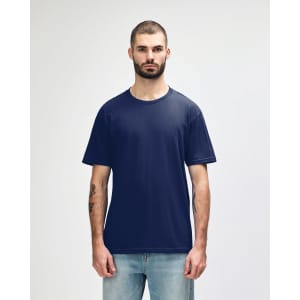 A navy blue midweight t-shirt on a model, featuring a simple design and a logo on the front.