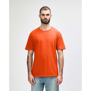 An orange midweight T-shirt for adults, displayed on a model with a neutral background. Features a logo.