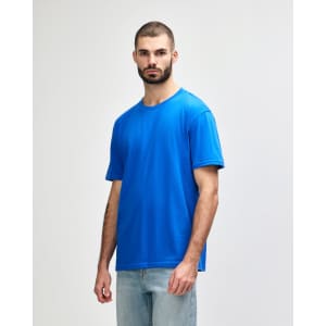 A midweight adult T-shirt in blue, featuring a round neck and short sleeves, with a logo on the side.