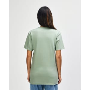 A man wearing a green Gildan Softstyle Adult Midweight T-Shirt, viewed from the back. The shirt has a logo.