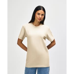A midweight adult t-shirt in beige with short sleeves, featuring a logo on the front.