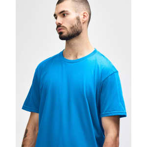 A bright turquoise adult midweight T-shirt on a model, featuring a round neckline and short sleeves.