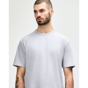 A grey midweight T-shirt with a relaxed fit, featuring a brand logo.