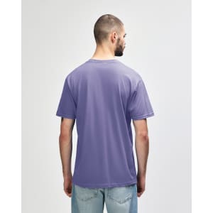 A midweight adult t-shirt in purple, featuring a simple design and a branding logo on the back.
