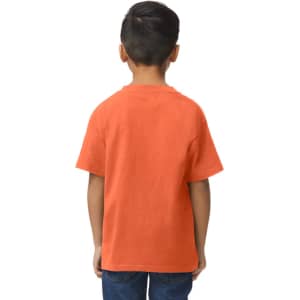 A youth midweight T-shirt in orange, featuring a logo, displayed on a boy standing sideways.
