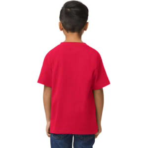 A red Gildan Softstyle youth midweight t-shirt displayed on a child standing sideways, with hands behind their back.
