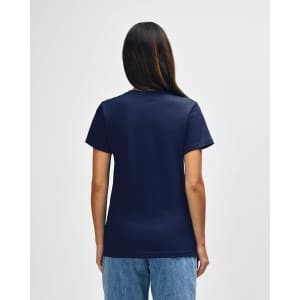 A navy blue ladies' midweight t-shirt featuring a branding logo on the back, worn by a model.