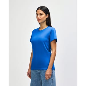 A blue midweight ladies' T-shirt featuring a round neckline and short sleeves, displayed by a smiling model.
