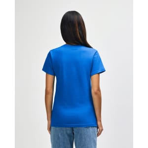 A blue Gildan Softstyle ladies midweight T-shirt displayed from the back, featuring a simple design.