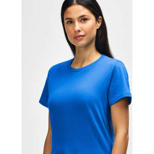 A midweight ladies' t-shirt in bright blue, featuring a round neckline and short sleeves, with a logo present.