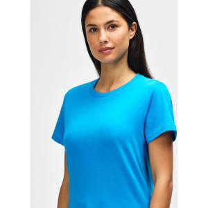 A blue Gildan Softstyle ladies midweight T-shirt displayed on a model with long brown hair.