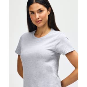 A grey Gildan Softstyle ladies midweight T-shirt on a model, featuring a round neckline and short sleeves.