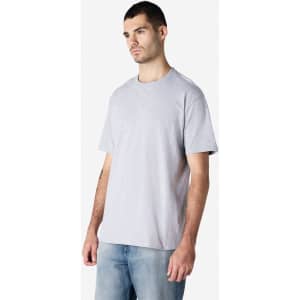 A grey Gildan Softstyle adult enzyme wash no label t-shirt on a male model, paired with blue jeans.