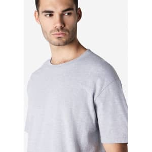 A grey Gildan Softstyle adult t-shirt, featuring a round neckline and short sleeves, with a brand logo visible.