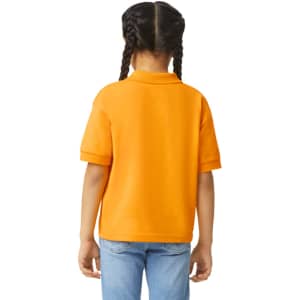 An orange Gildan youth polo shirt displayed from the back, featuring a collar and short sleeves.