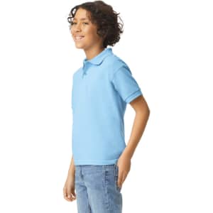 A light blue youth polo shirt displayed on a smiling child, showcasing its collar and short sleeves.