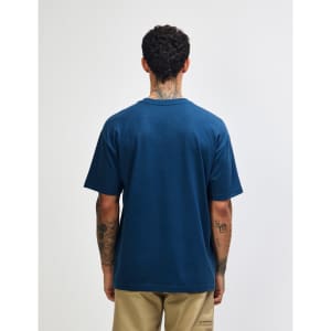 A blue American Apparel Super Heavyweight T-Shirt viewed from the back, with a simple design and a logo.