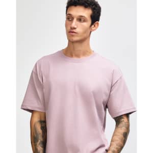 A model wears a purple American Apparel Super Heavyweight T-Shirt, featuring a simple design and relaxed fit.