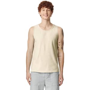A light cream tank top displayed on a model, featuring a logo on the front.