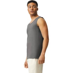 A grey adult tank top displayed on a model, featuring a round neckline and a logo on the fabric.