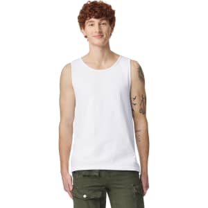 A white tank top featuring a scoop neckline and a logo on the side, modelled by a person with curly hair.