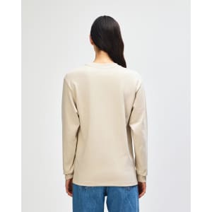 A beige American Apparel Super Heavyweight T-Shirt displayed from the back, featuring long sleeves and a simple design.