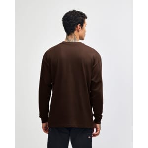 A brown heavyweight t-shirt with long sleeves, viewed from the back, featuring a plain design and a logo.