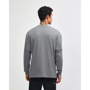 A grey long sleeve t-shirt with a simple design and a logo on the back.