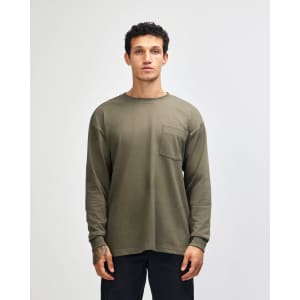 A long-sleeved, olive green heavyweight T-shirt featuring a pocket and a logo.