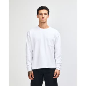 A lightweight, long-sleeve, grey T-shirt featuring a front pocket and a logo.