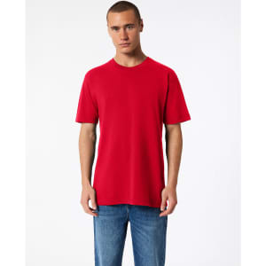 A red unisex fine jersey short sleeve T-shirt displayed on a model, featuring a plain design and a relaxed fit.