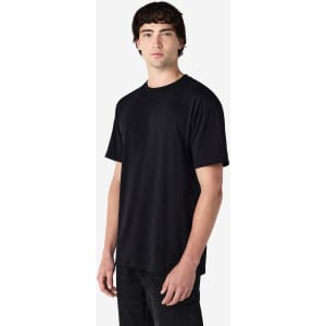 A black Gildan Hammer Adult T-Shirt on a model, featuring a plain design and a logo on the shirt.