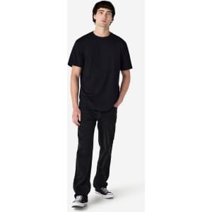 A black Gildan Hammer adult T-shirt displayed on a model, paired with black pants and shoes.