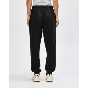 Unisex sweatpants in black with an elastic waistband and tapered cuffs, featuring a logo on the back.
