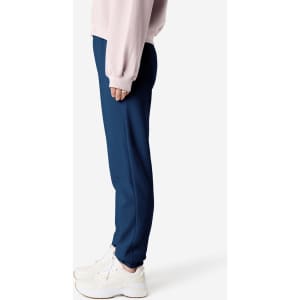 Unisex sweatpants in navy blue, featuring a slim fit and elastic cuffs, with a logo on the waistband.