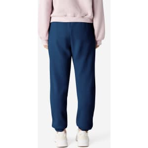 Unisex sweatpants in navy with a fitted cuff and a branding logo on the fabric.