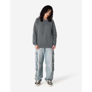 A grey unisex crewneck sweatshirt worn with light blue cargo pants and black shoes. The sweatshirt has a logo.