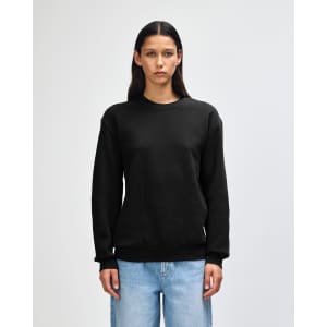 A unisex crewneck sweatshirt in black, featuring long sleeves and a relaxed fit. The garment has a logo present.