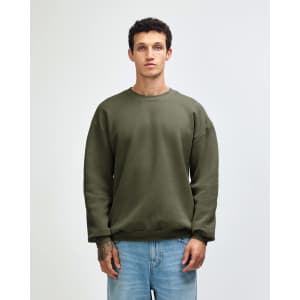A unisex crewneck sweatshirt in olive green with long sleeves and a relaxed fit, featuring a logo.