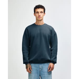 A unisex crewneck sweatshirt in a deep blue colour, featuring a simple design and a logo.