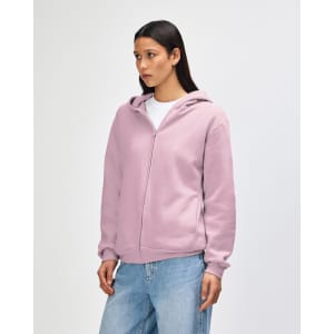 A unisex full zip hooded sweatshirt in light pink with a side view and a logo.