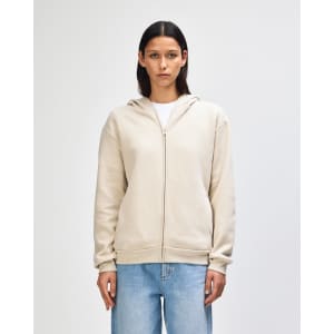 A unisex full zip hooded sweatshirt in a light beige colour with a hood and front zip, featuring a logo.